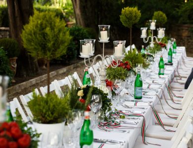Festive dinner table decorated in white and green tones